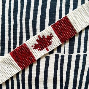 Red and White Beaded Bracelet with Maple Leaf Design